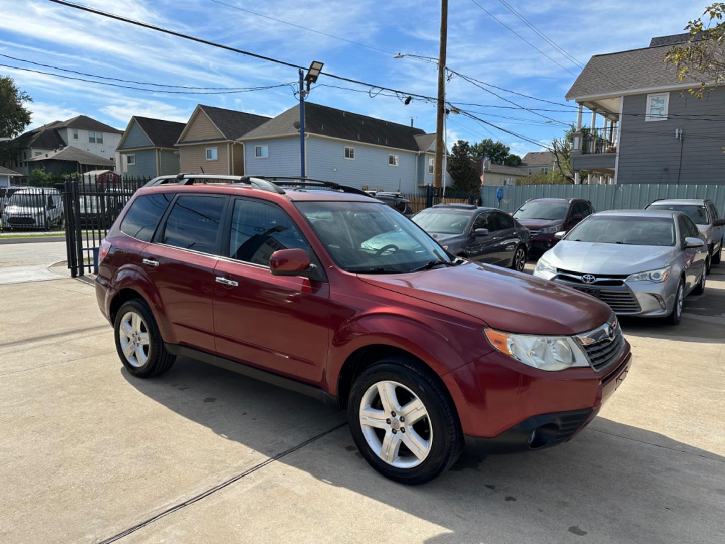 2009 Red /Black Subaru Forester X Limited (JF2SH64619H) with an 2.5 engine, Automatic transmission, located at 1501 West 15th St., Houston, 77008, (713) 869-2925, 29.797941, -95.411789 - Photo#1